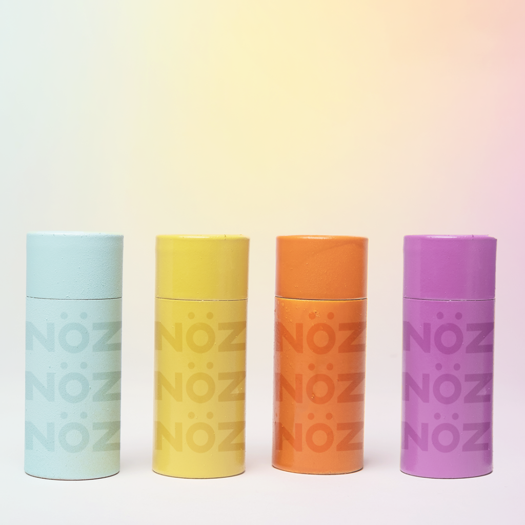 Nöz colorful nose sunblock in baby blue, yellow, orange and magenta